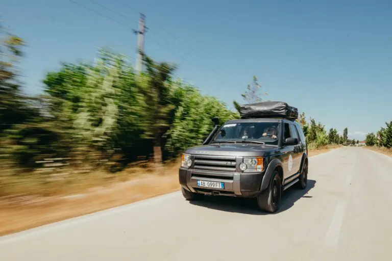 grey land rover driving on a road in Albania